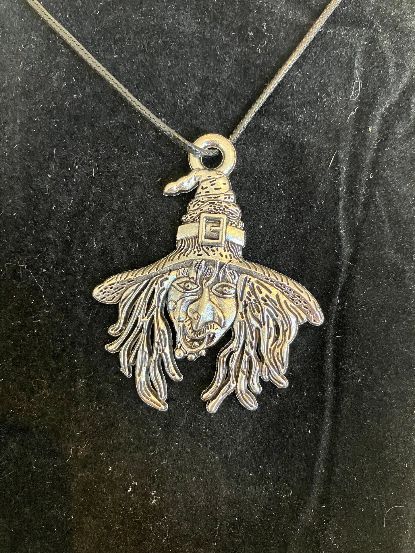 Antique silver colour witch face pendant