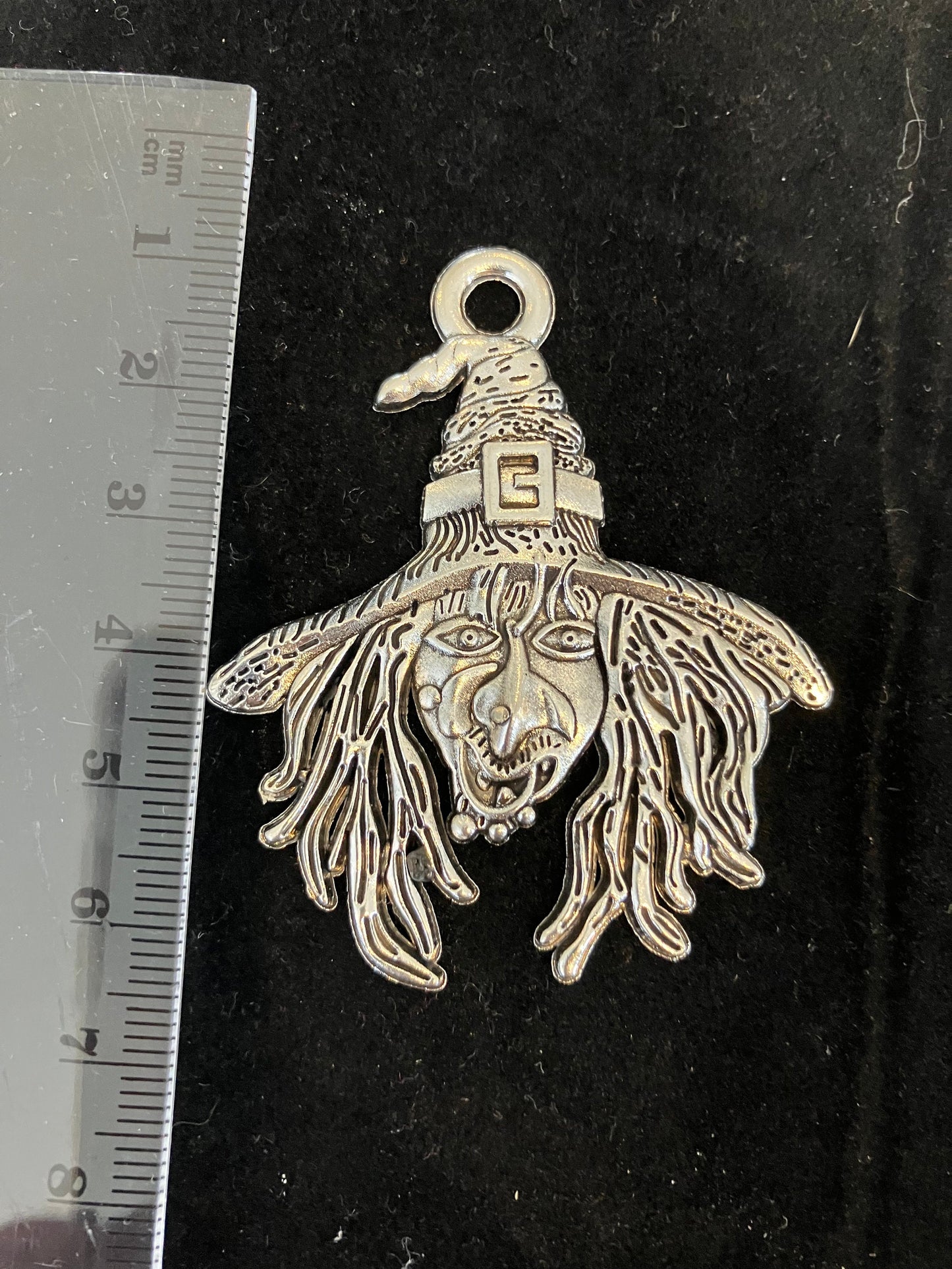 Antique silver colour witch face pendant