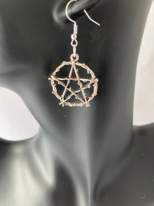 Hand made earrings with textured pentagram